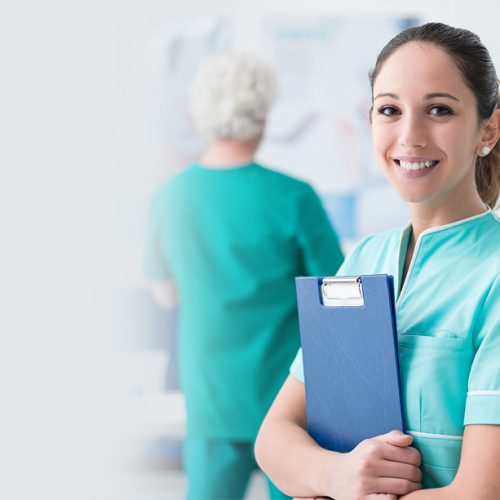 Healthcare workers, medicine, insurance and covid-19 pandemic concept. Confident and enthusiastic young female nurse, doctor in blue scrubs and glasses, hold stethoscope, smiling camera pleased.